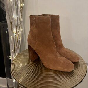 Michael Kors Hazel Suede Block Heel Booties in a brown or "camel" color.